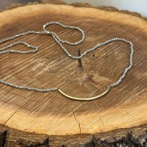 Delicate Gray Beaded Necklace with Gold Curved Bar